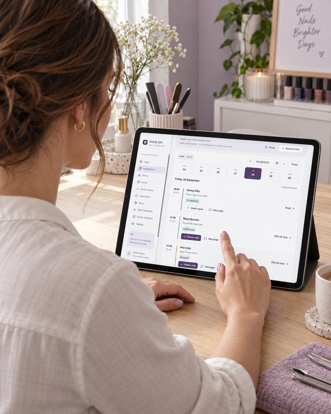 Illustrative nail professional looking at the Beauty Pro calendar